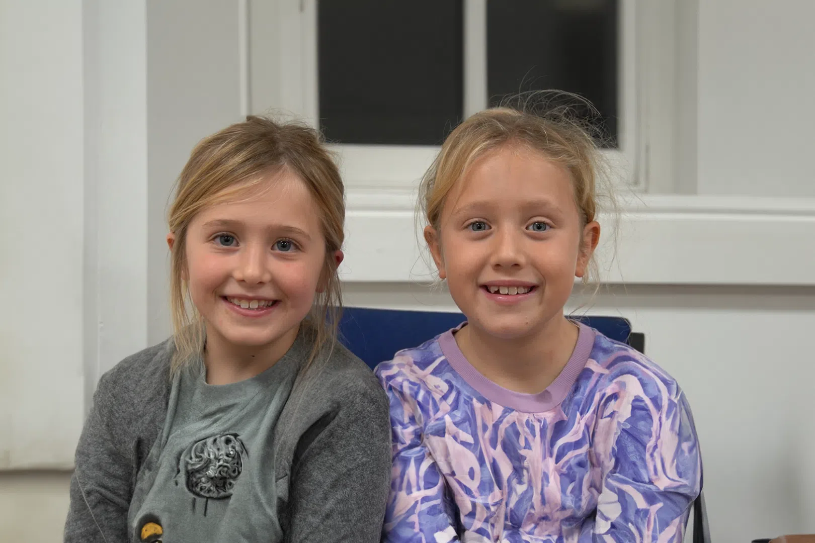 Two Young people smiling.